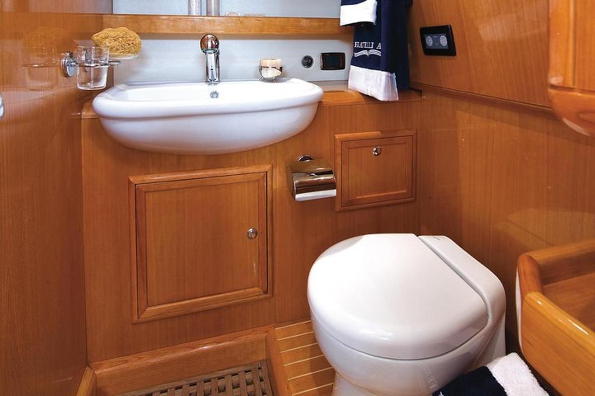 a bathroom with a white toilet and a sink