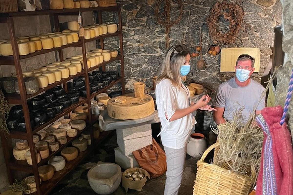 a man and a woman wearing face masks in a bakery