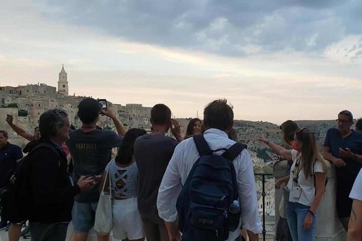 a group of people looking at the city