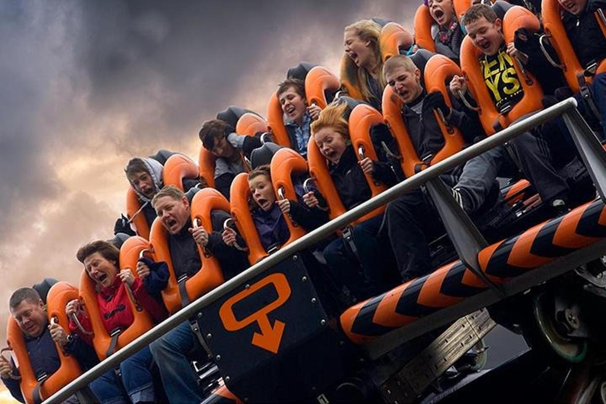 a group of children riding on an roller coaster