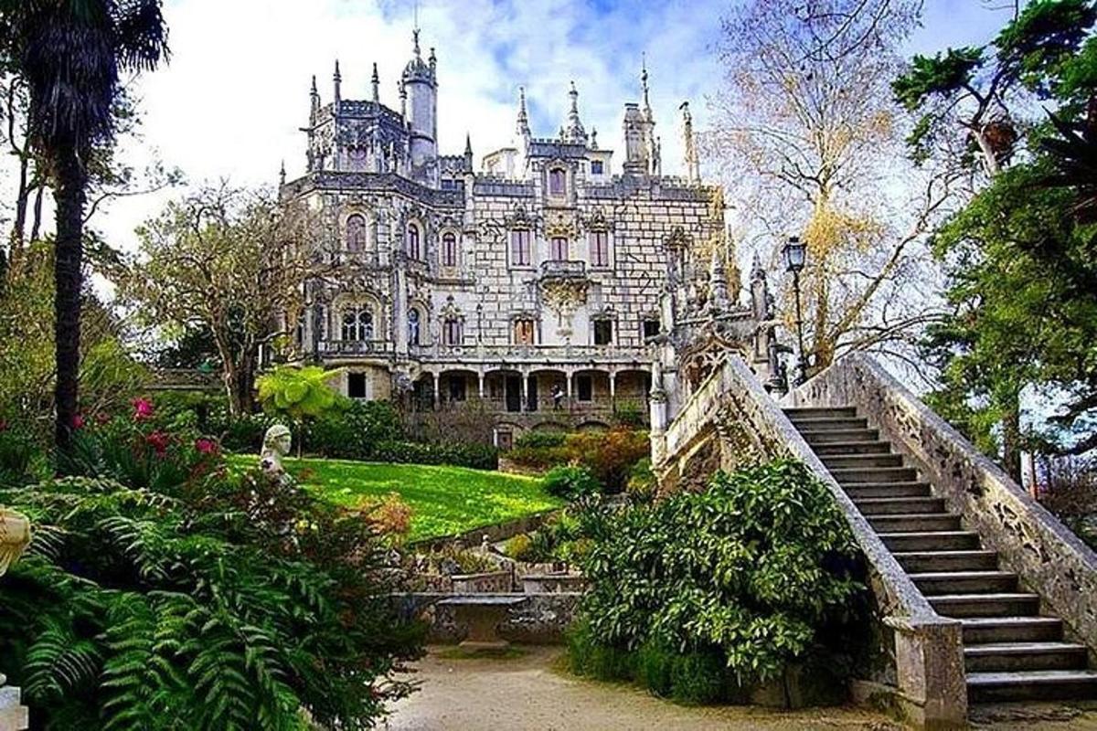 a large house with stairs in front of it