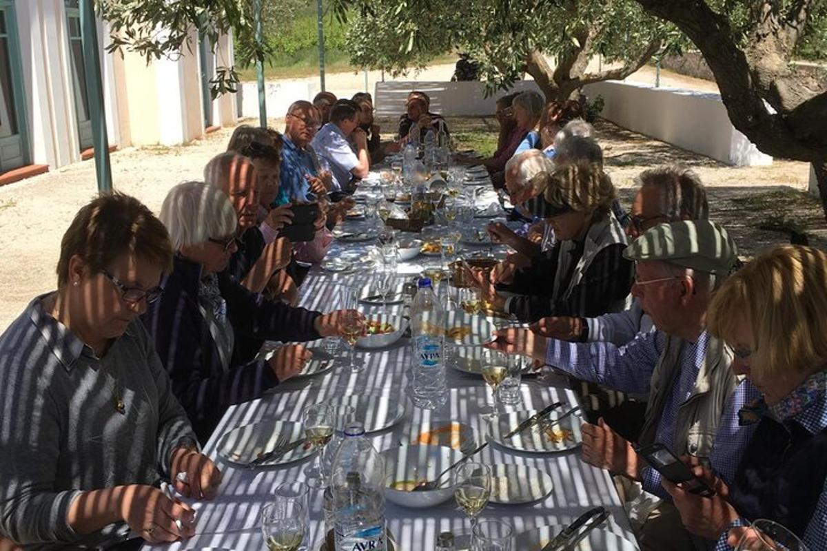 a large group of people sitting at a long table