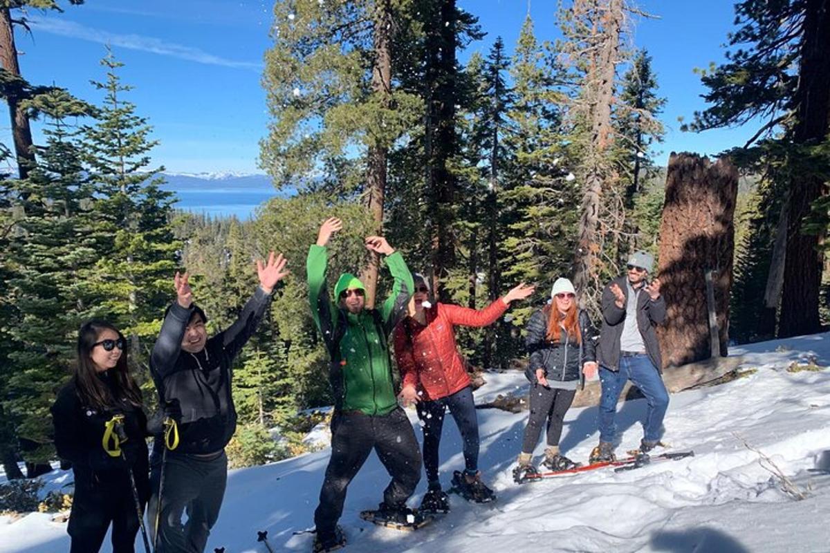 a group of people posing for a picture in the snow