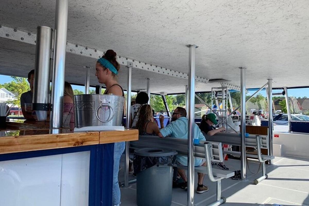 a group of people sitting inside of a food truck