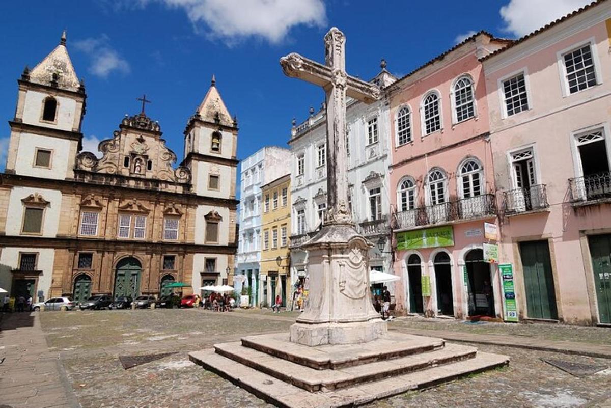 a statue of a cross in the middle of a street