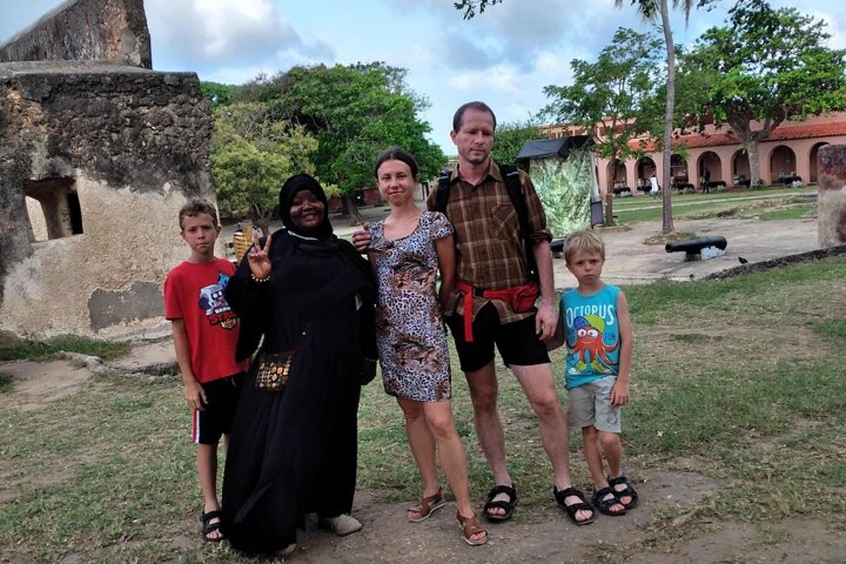 a family posing for a picture in front of a building