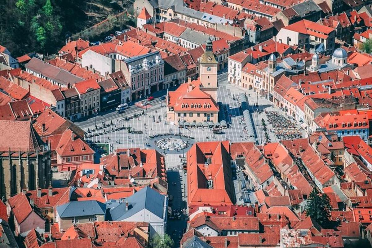 an aerial view of a city with red roofs