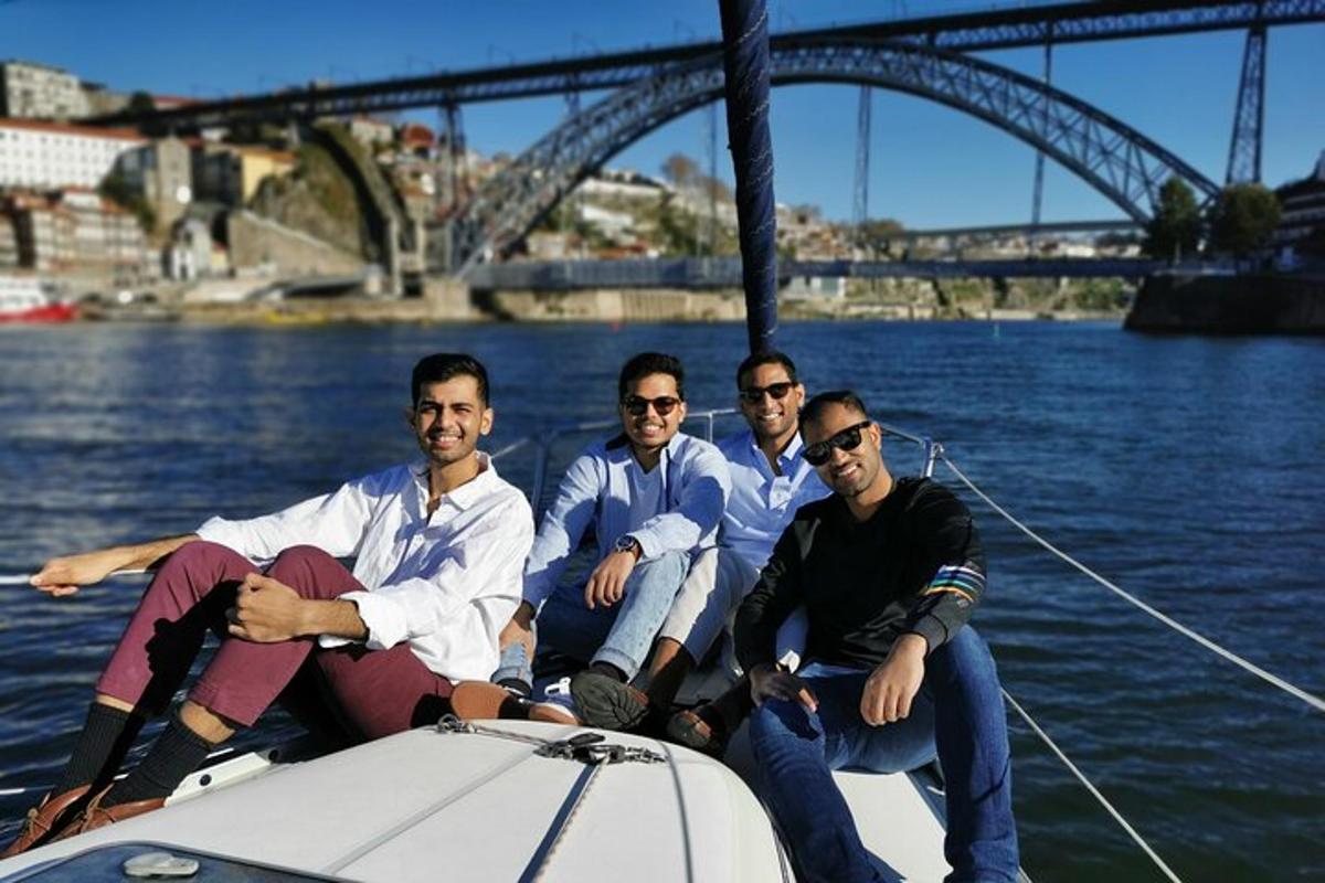 a group of men sitting on a boat in the water