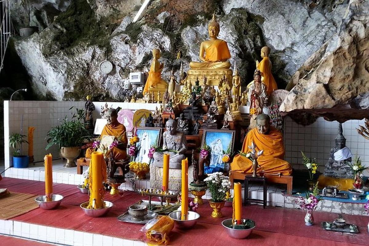 a group of statues of monks in a temple
