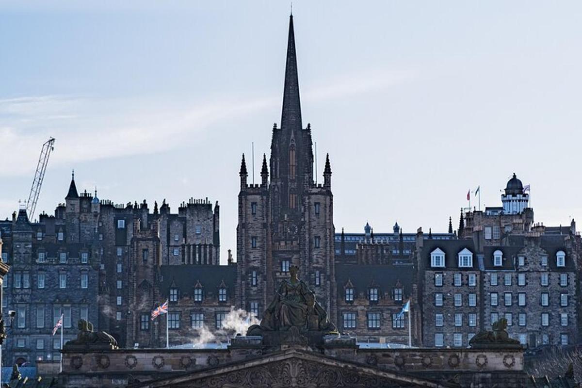 a large building with a spire in front of it