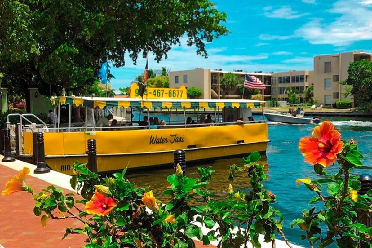 a yellow boat is docked on the water