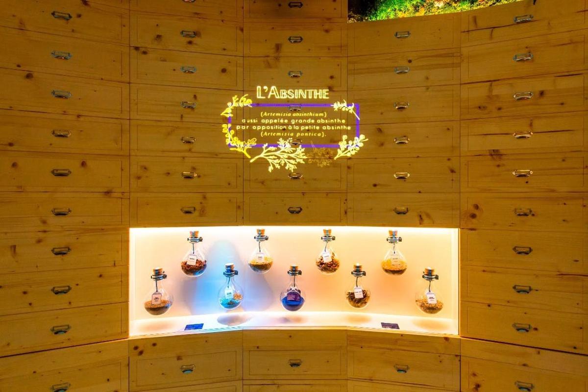 a display case with a bunch of acoustic guitars