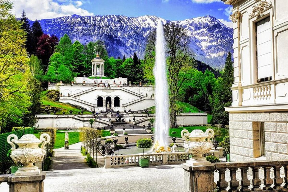 a fountain in front of a building with a waterfall