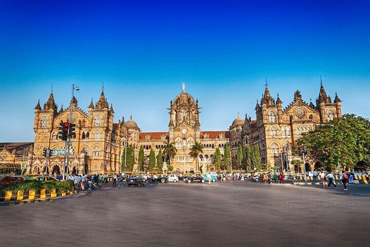 a large building with a clock tower in front of it