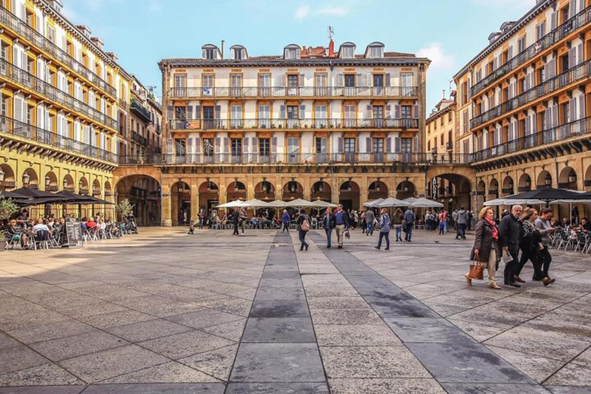 a group of people walking in a city square