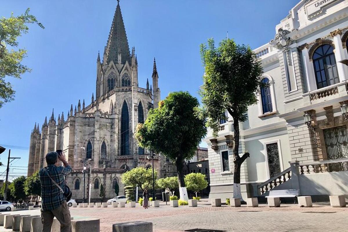 a man taking a picture of a cathedral