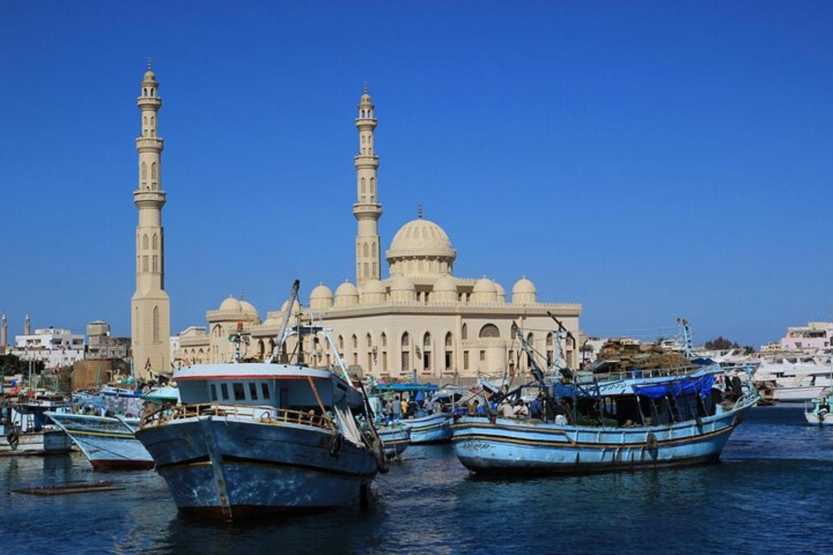 a group of boats in the water in front of a building