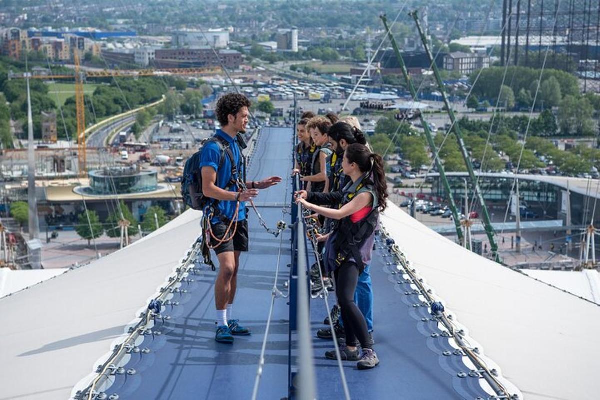 a group of people standing on top of a bridge