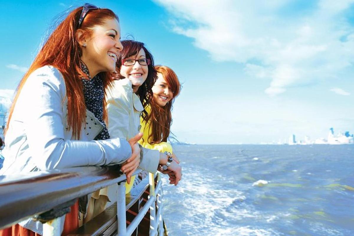 three women on a boat in the water