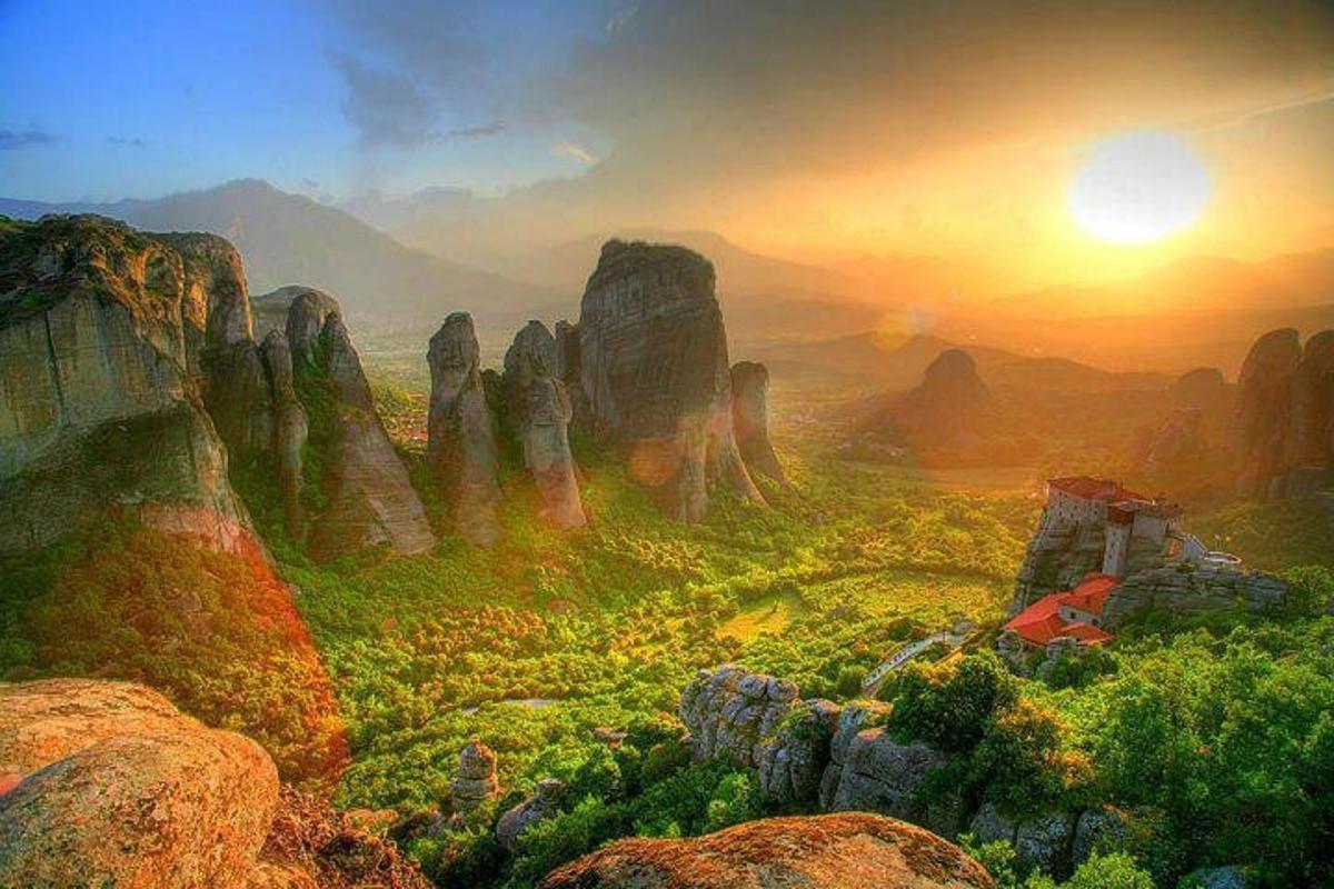 a painting of a view of a valley with rocks