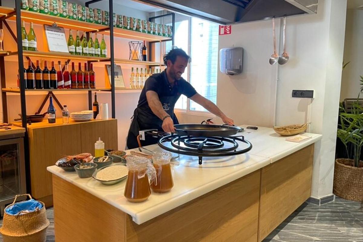 a man preparing food on a stove in a kitchen