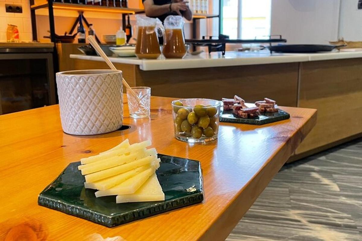 a table with a plate of cheese and fruit on it