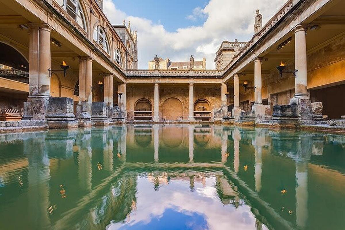 a courtyard with a pool of water in a building