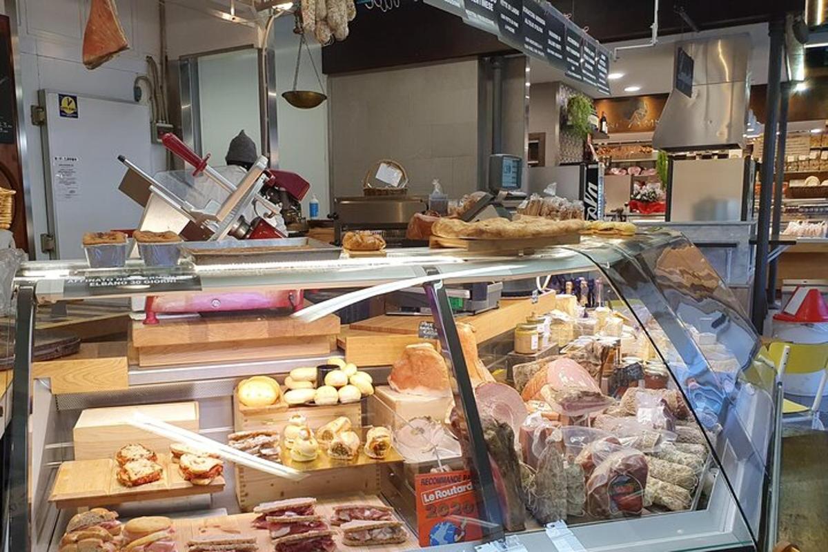 a bakery with a display case filled with different types of pastries