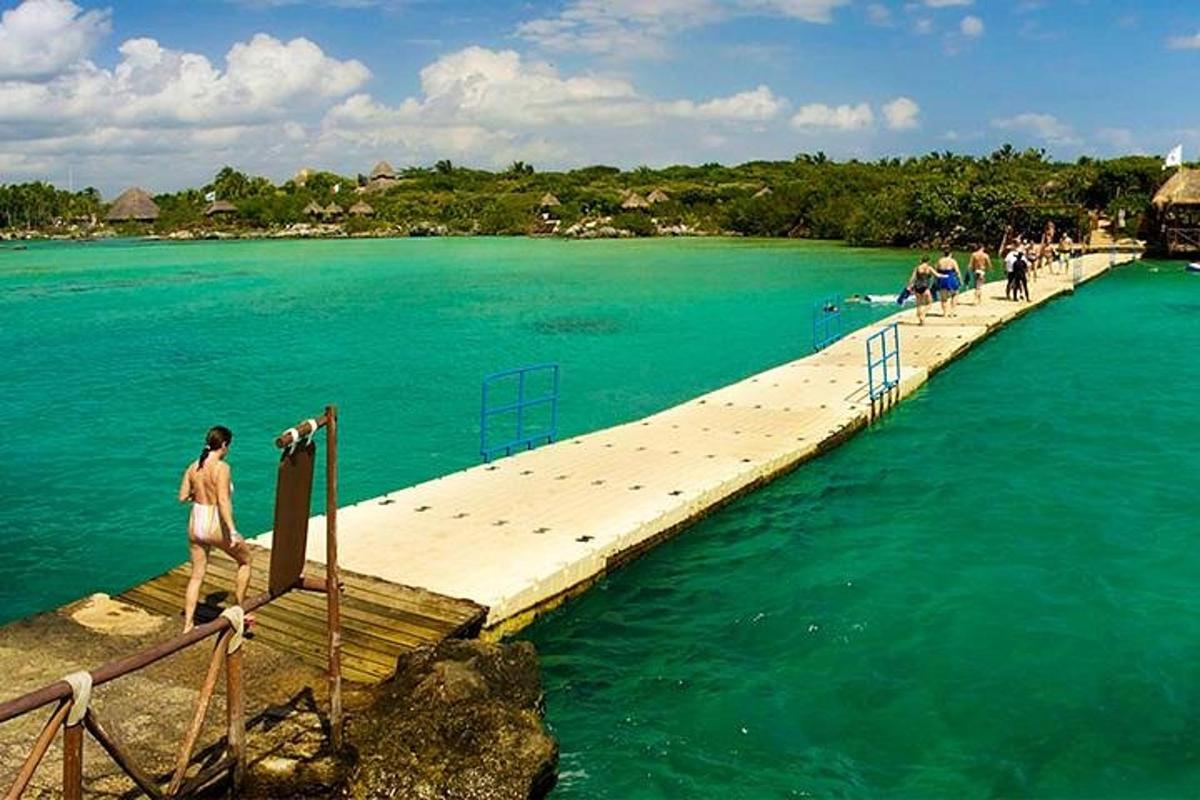 a person standing on a dock in the water