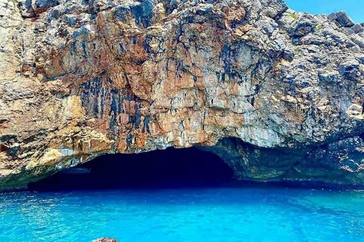 a cave in the side of a rocky cliff