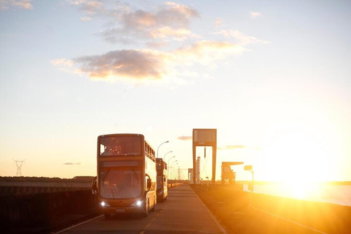 a double decker bus is driving down a highway