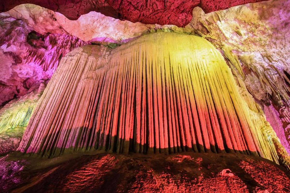 a painting of a cave with colorful walls