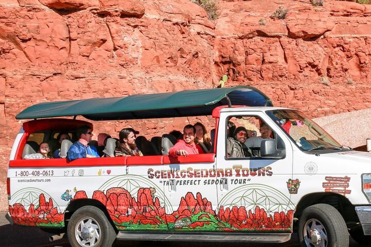 a group of people riding in a tour truck