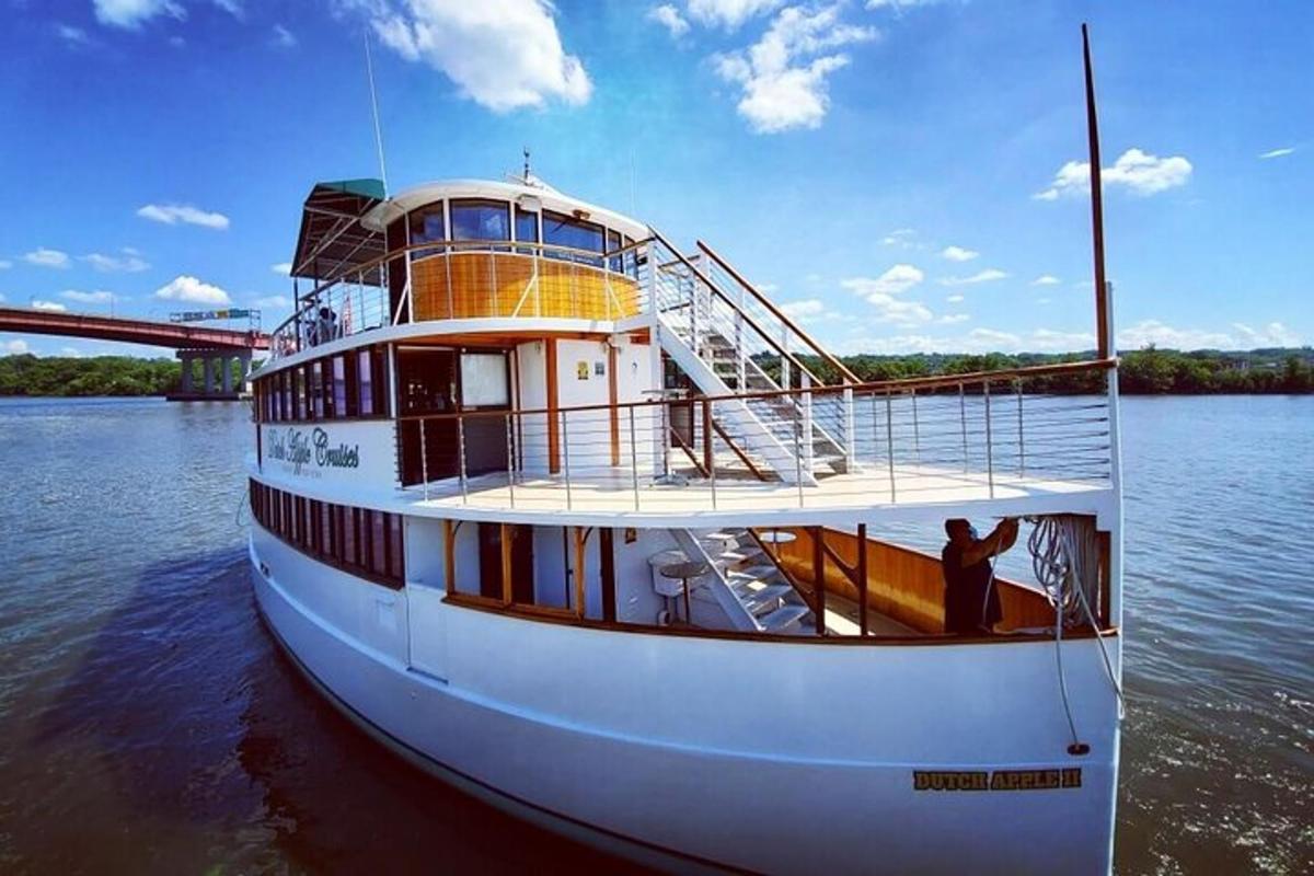 a boat on the water with a man standing on it