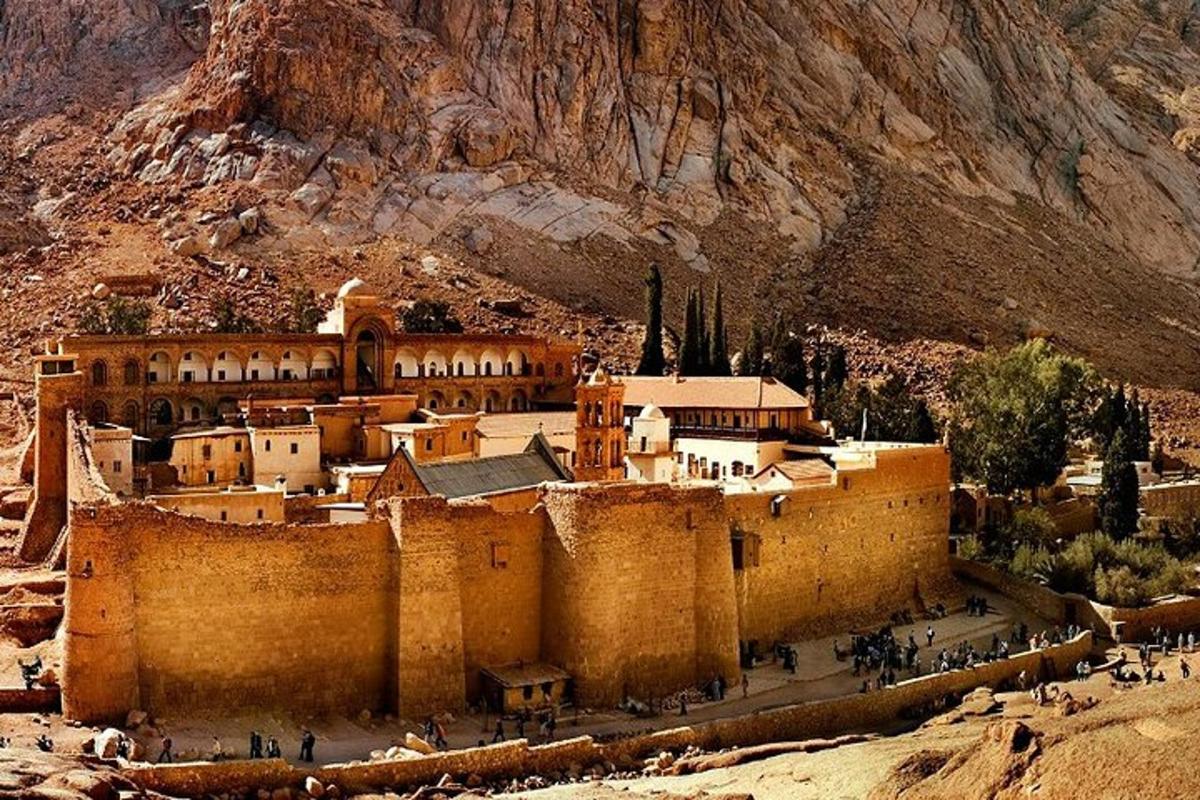 a large building in the middle of a mountain