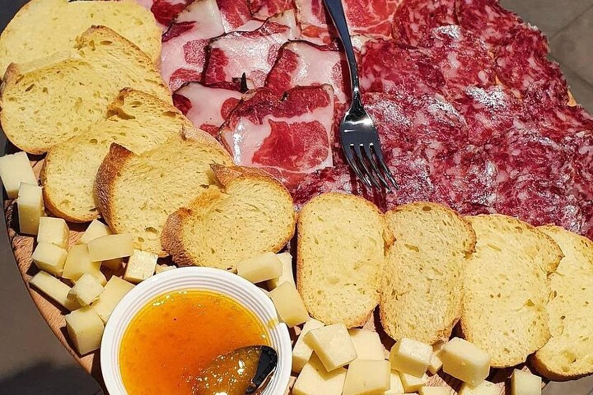 a plate of food with a pizza and bread and cheese