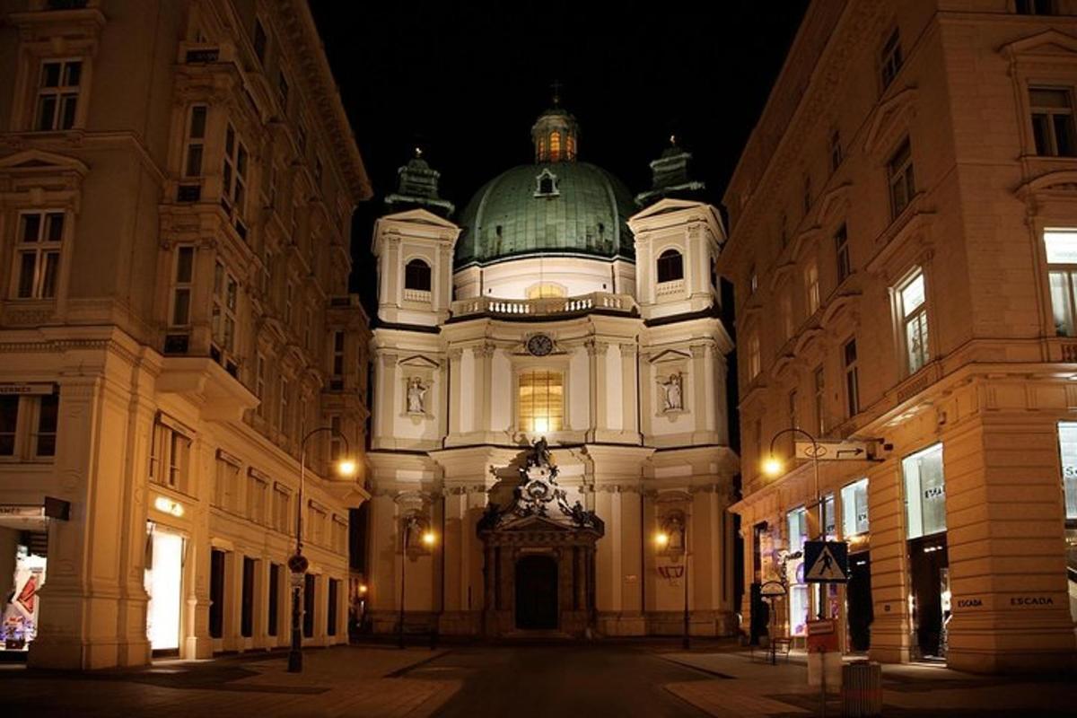 a large white building with a green dome on a street