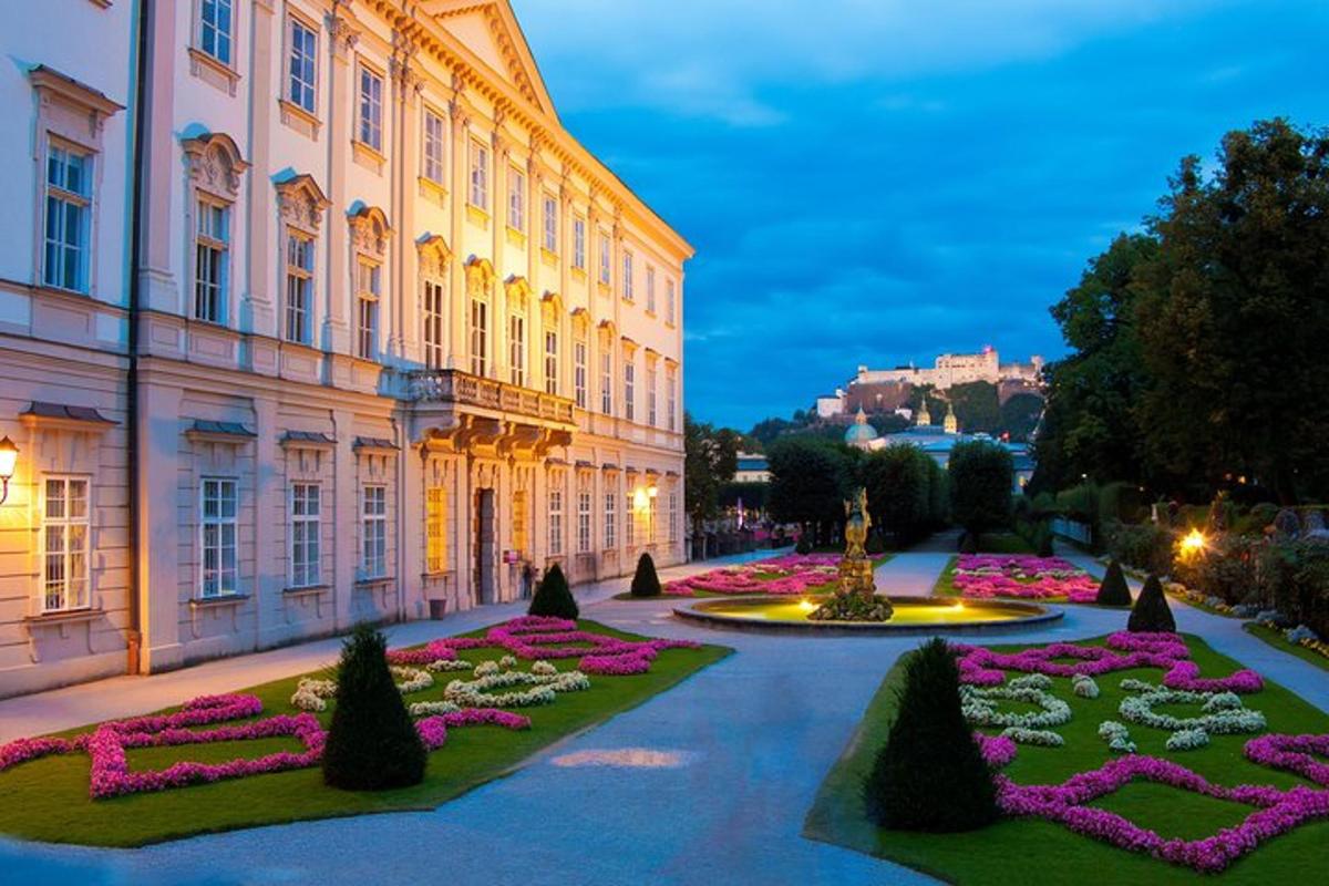 a building with a flower garden in front of it