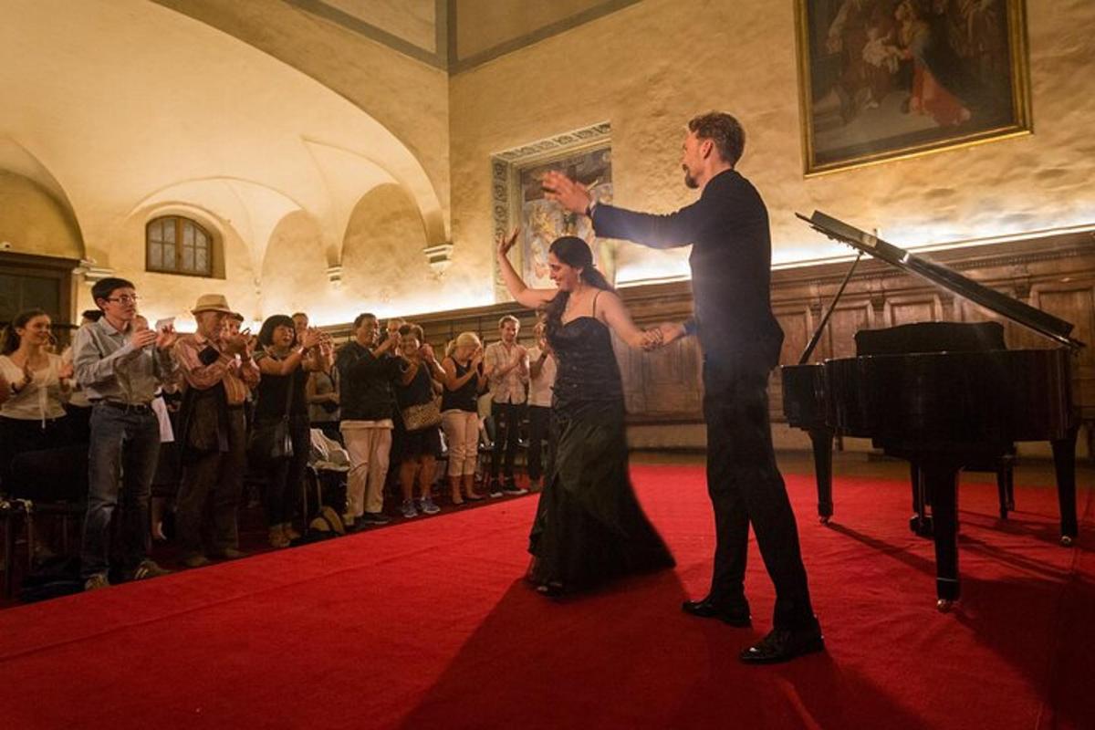 a man and a woman dancing on a red carpet