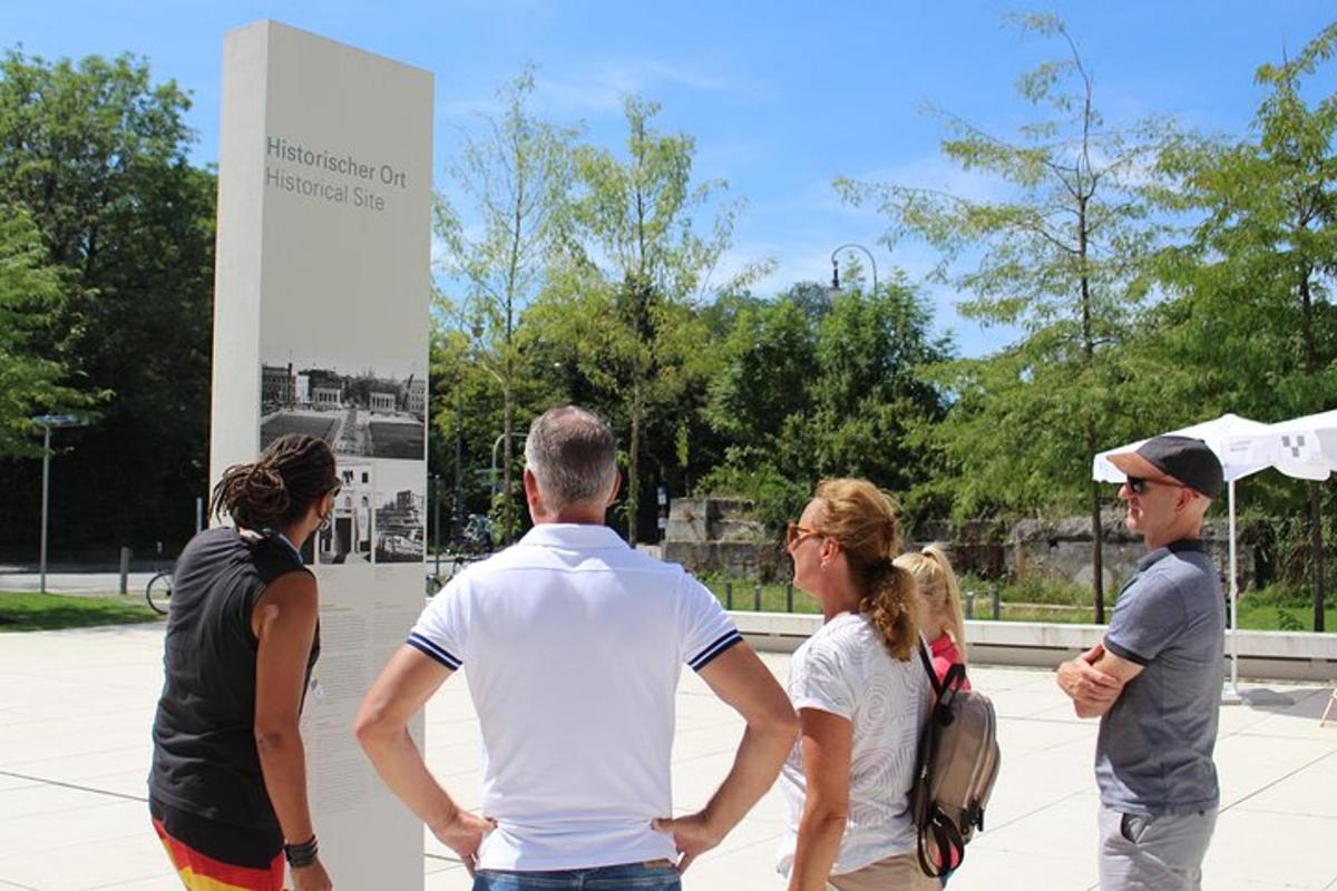 a group of people standing in front of a sign