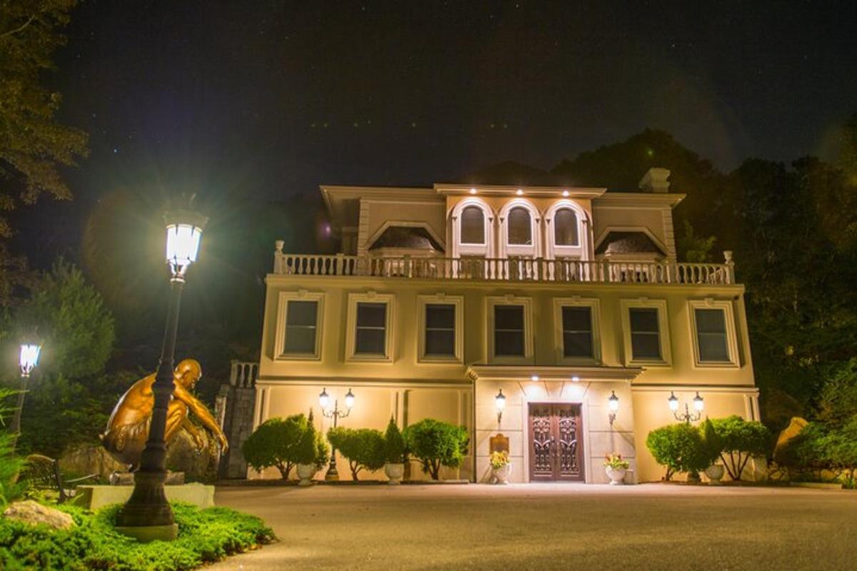 a large house at night with a street light