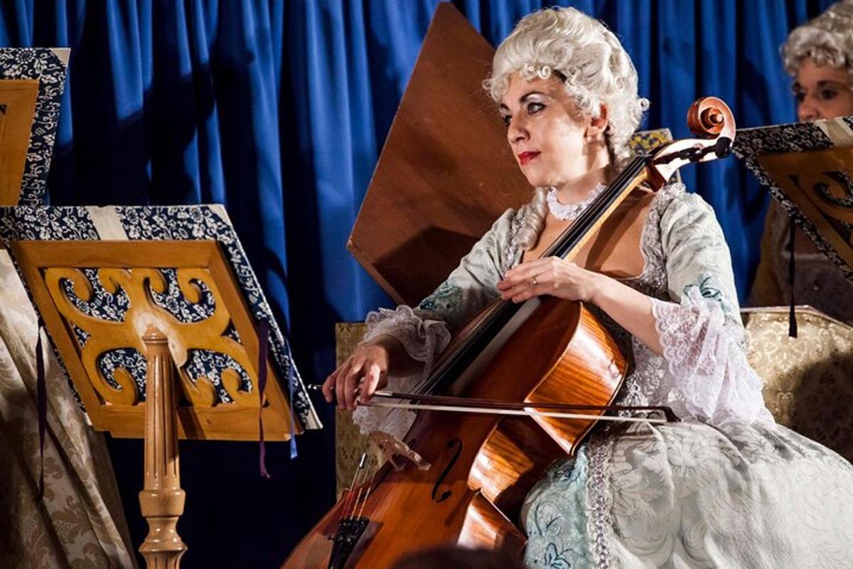 a woman playing a cello in a performance