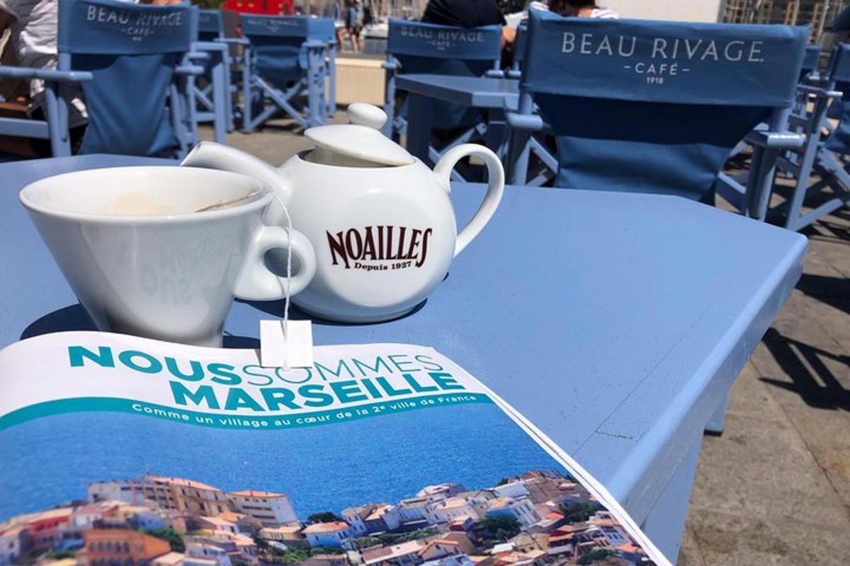a table with a cup of coffee and a magazine