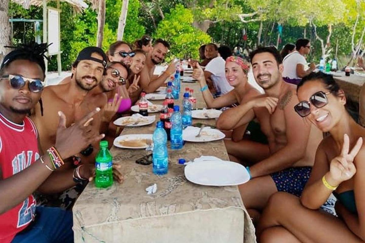 a group of men sitting around a long table