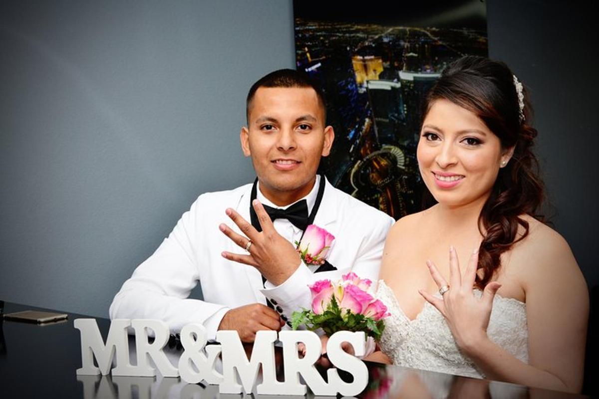a bride and groom are posing for a picture