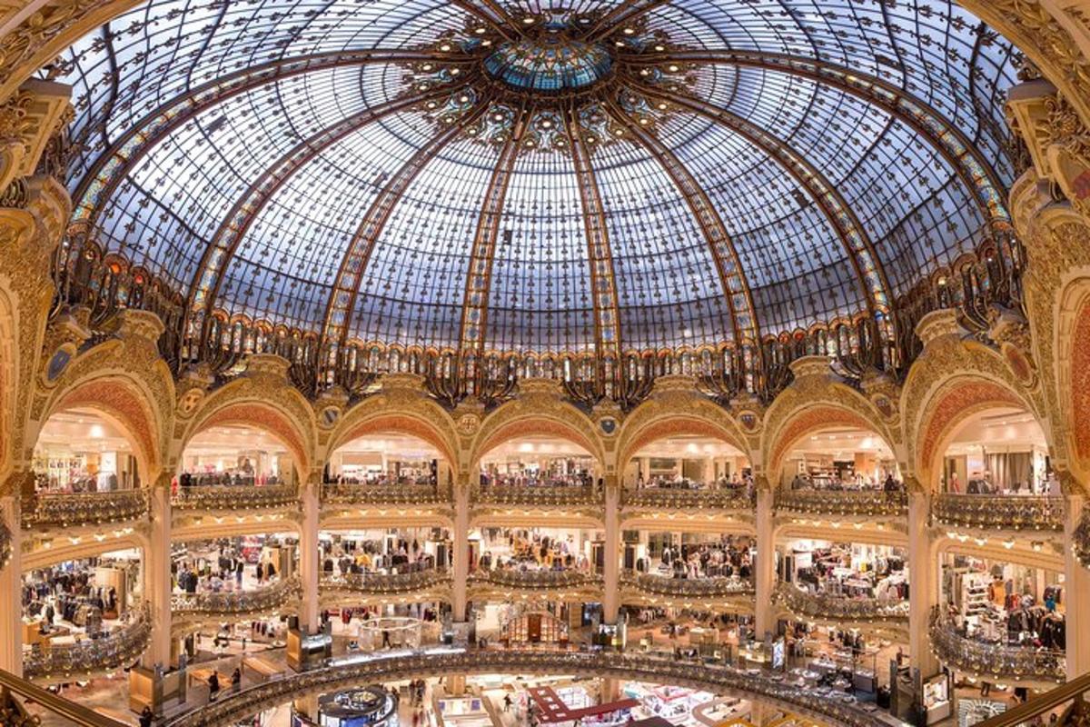 a large shopping mall with a glass domed ceiling