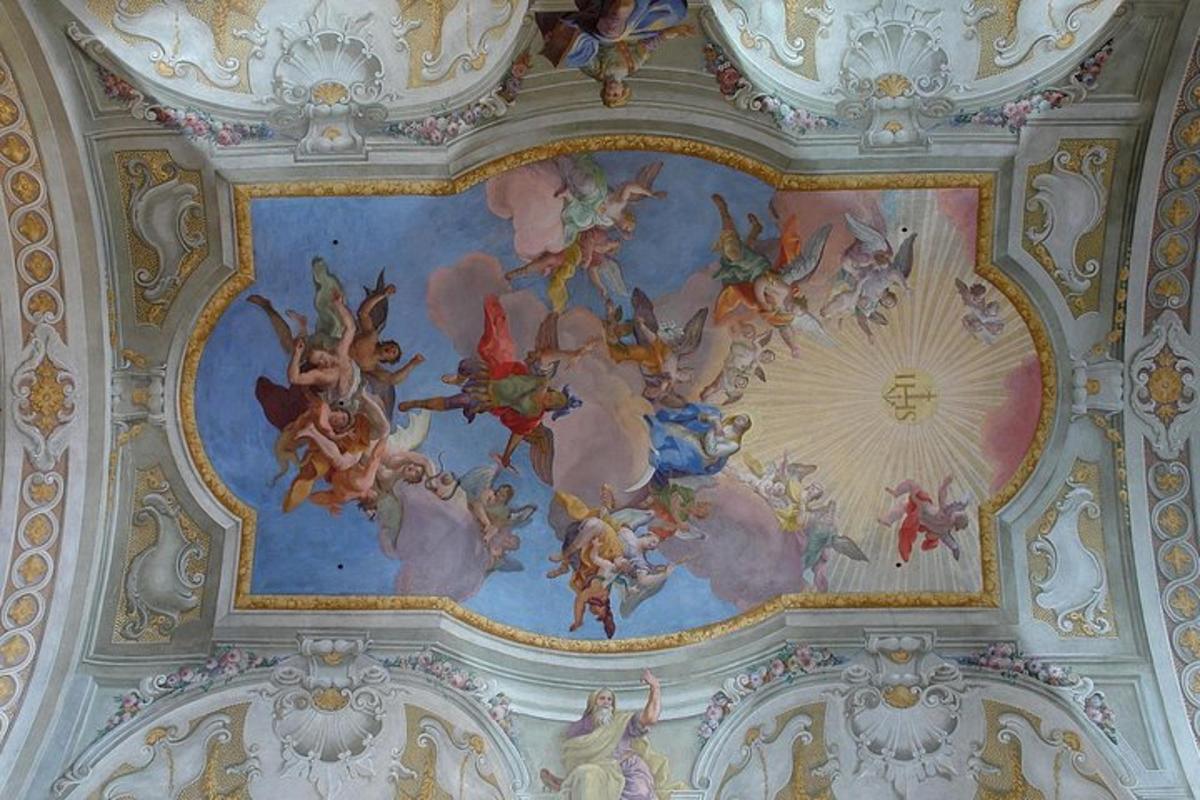 a ceiling with a painting of angels on it