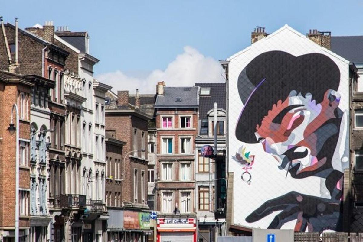 a large painting of a person on the side of a building
