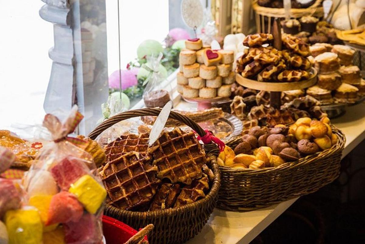 a buffet of waffles and pastries on a table