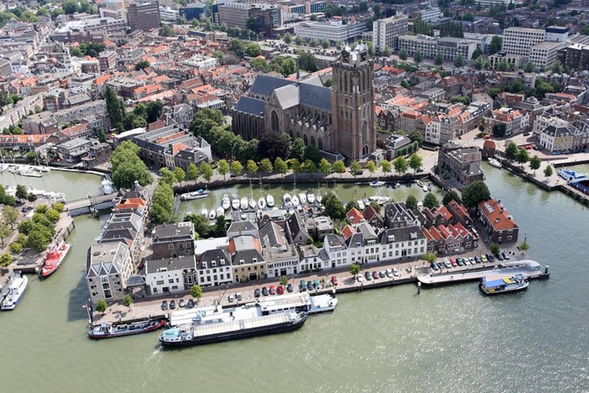 an aerial view of a city with boats in the water